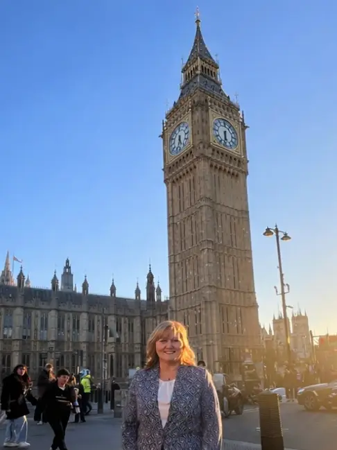 Person standing in front of Big Ben.